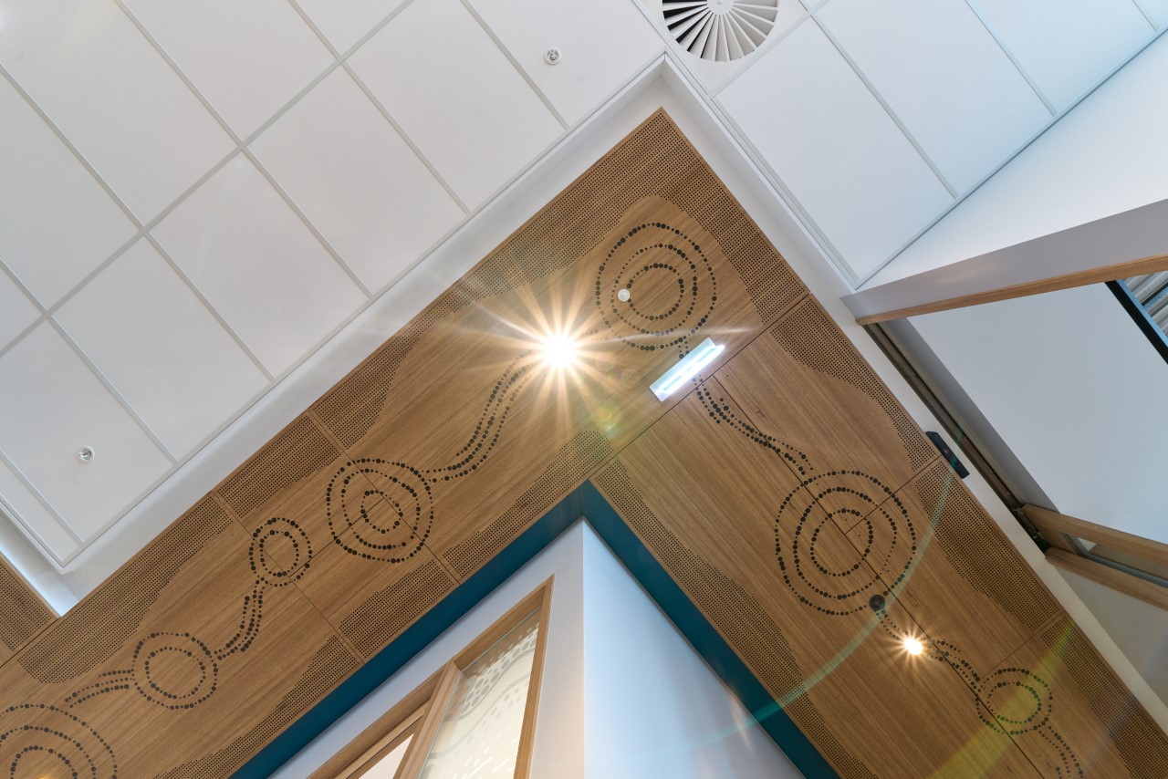 Artwork along ceiling representing Seven Sisters Songline and Tjukurpa.