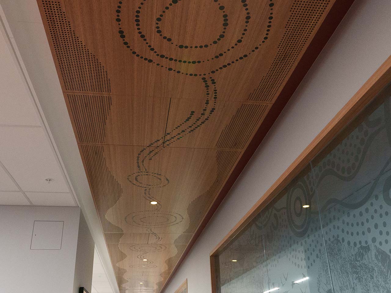 Artwork along ceiling representing Seven Sisters Songline and Tjukurpa.