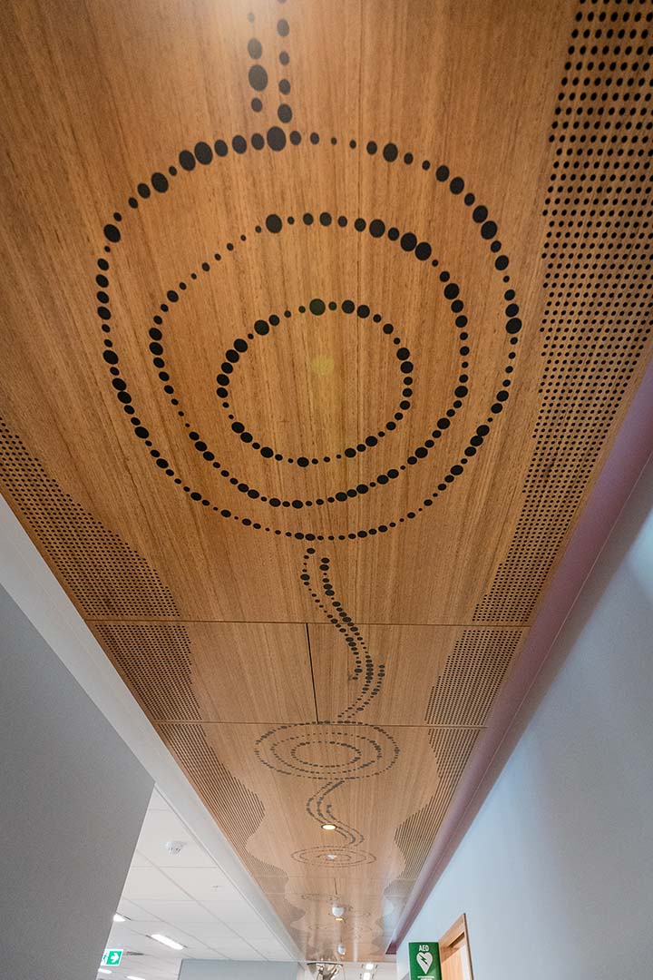 Artwork along ceiling representing Seven Sisters Songline and Tjukurpa.