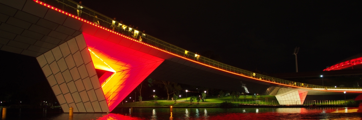 Riverbank bridge at night time Riverbank bridge at night time