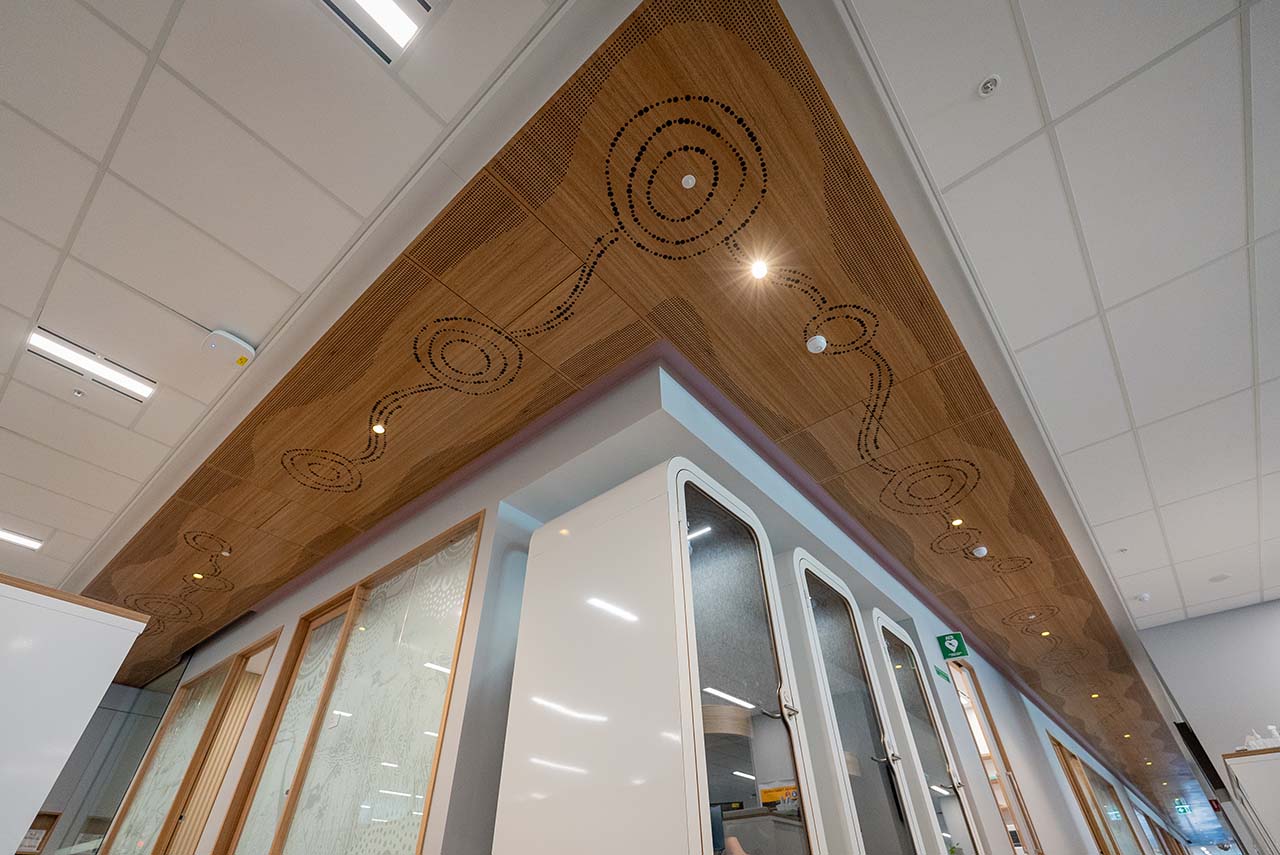 Artwork along ceiling representing Seven Sisters Songline and Tjukurpa.